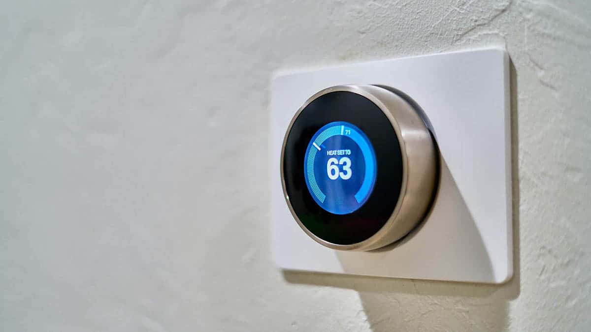 Smart thermostat mounted on a wall